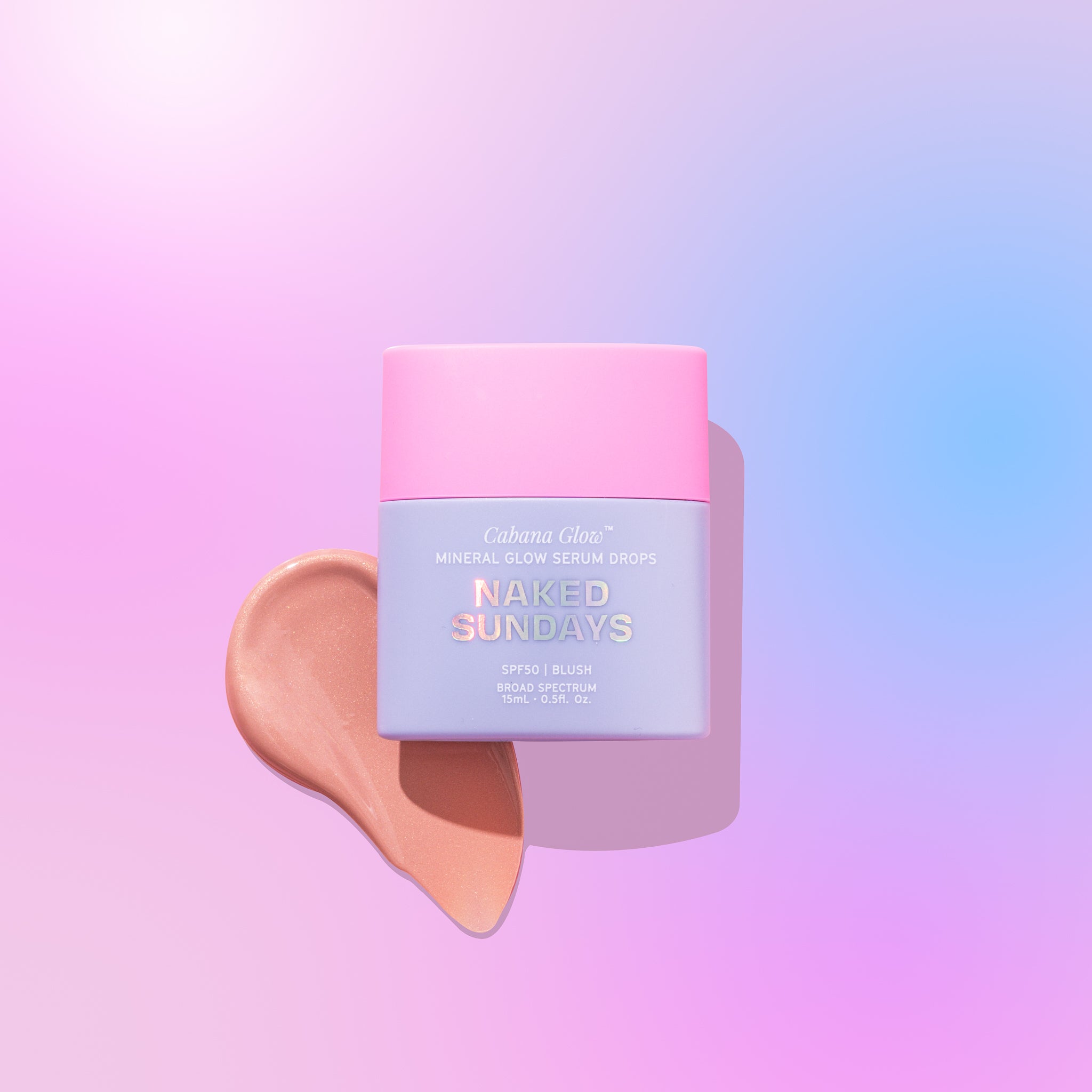 A bottle of CabanaGlow SPF50 Mineral Glow Serum Drops Mini in Blush with a pink Lid and a swatch of the blush color shown beside it, on a two-tone background transitioning from pink to blue.