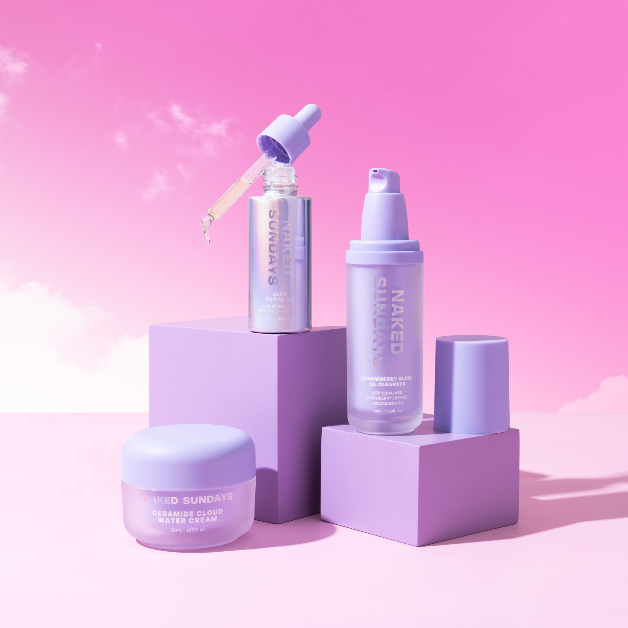 The Skincare Bundle products creatively displayed on a pink background