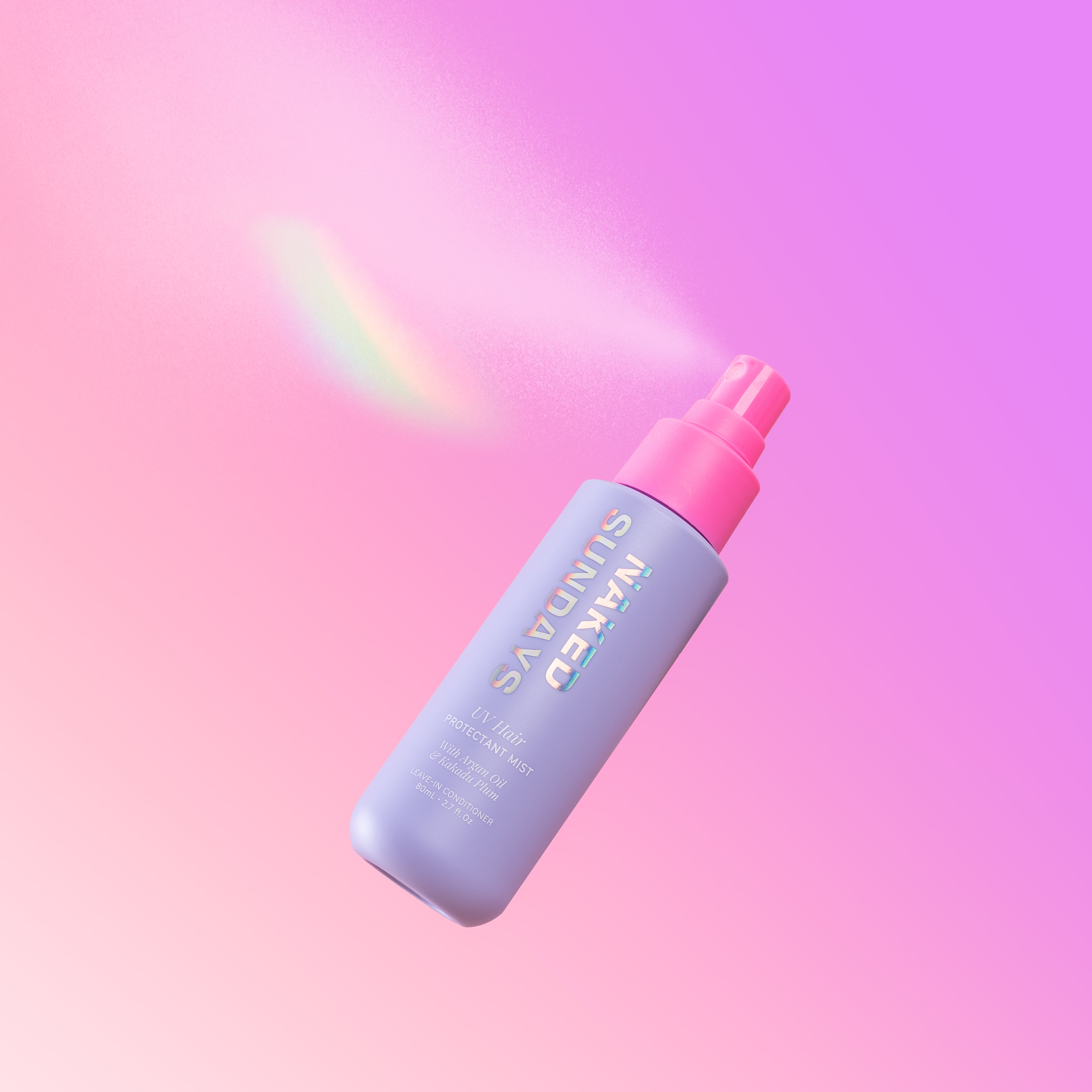A spray bottle of UV Hair Protectant Mist with a pink nozzle against a pink gradient background.