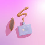 A bottle of CabanaGlow SPF50 Mineral Glow Serum Drops Mini in Bronze against a pink background.
