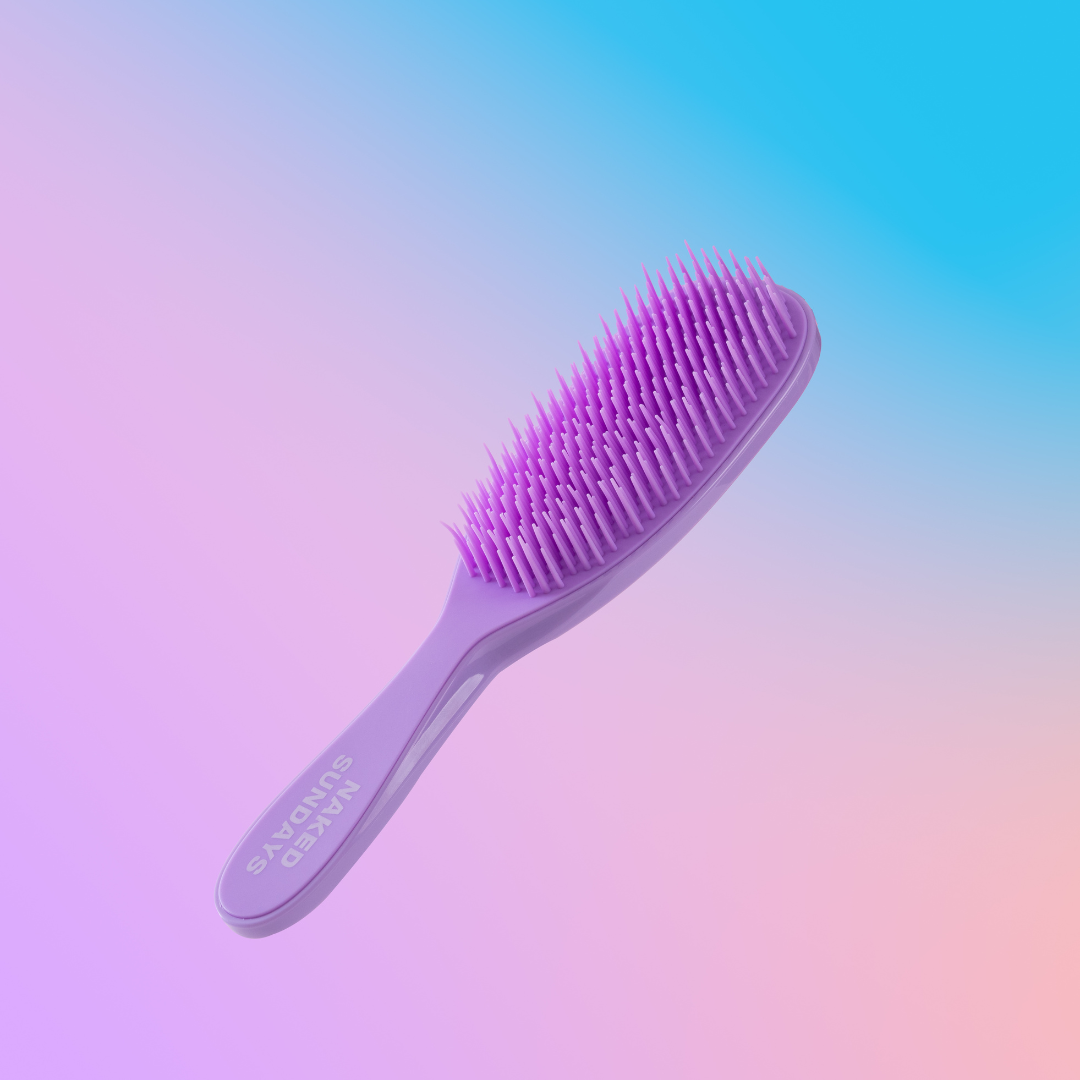 A purple detangling hair brush with flexible bristles, displayed against a gradient background.