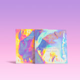 Two sheet masks with colorful, iridescent packaging on a light purple background.