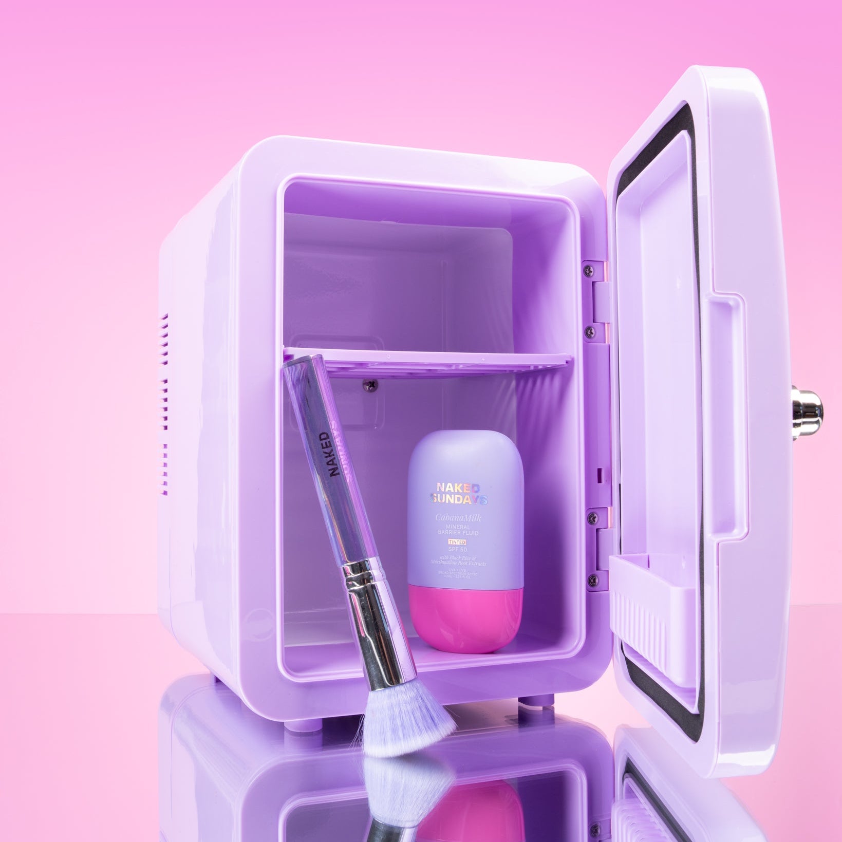 Lilac Cosmetics Fridge open with CabanaMilk SPF50 and Holographic Brush on a pink background