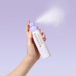 Glow Body Mist SPF50+ - Bottle in Hand Spraying